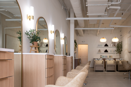 Styling stations and shampoo area inside Maria Aiello Salon in Mamaroneck, NY